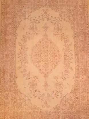 A close up of a rug with a floral pattern on it.