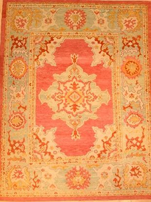 A rug with a floral pattern on it is sitting on a table.