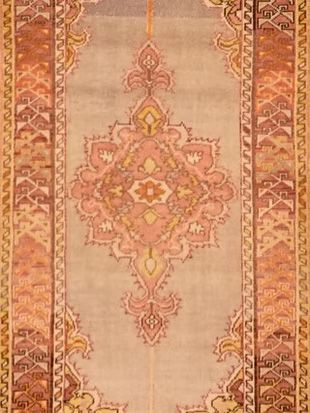 A close up of a rug with a pattern on it.