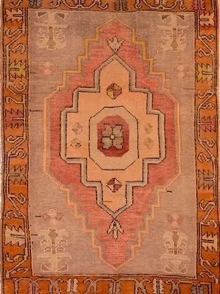 A close up of a rug with a pattern on it