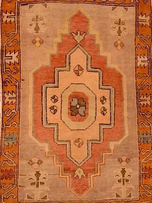 A close up of a rug with a geometric pattern on it