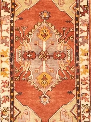 A close up of a rug with a geometric pattern