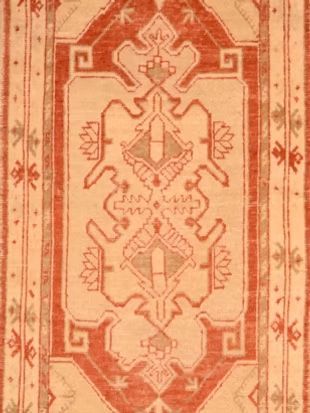 A close up of a rug with a geometric pattern