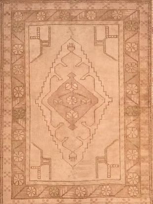 A close up of a rug with a geometric pattern on it.