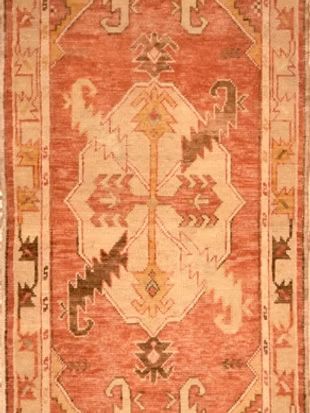 A close up of a rug with a geometric pattern on it.