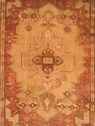 A close up of a rug with a geometric pattern on it.