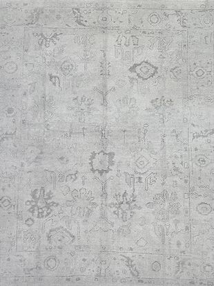 A close up of a gray rug with a pattern on it.