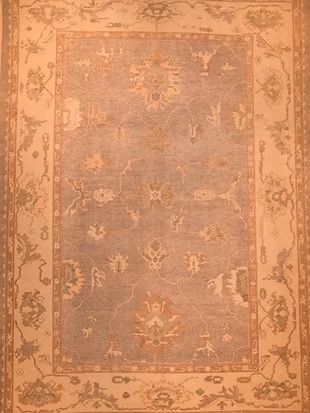 A rug with a floral pattern on it is sitting on a table.