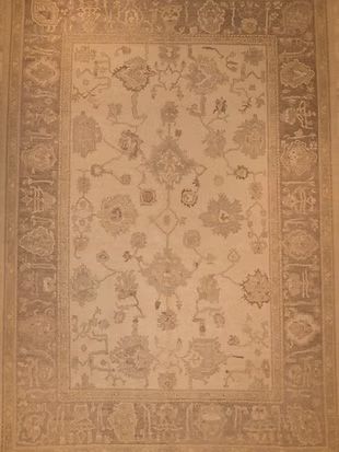 A close up of a rug with a floral pattern on it.