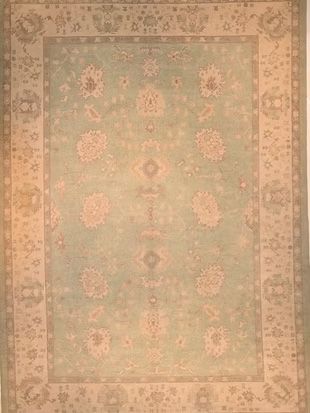 A rug with a floral pattern on it is sitting on a table.