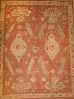 A rug with a pattern on it is sitting on a table.