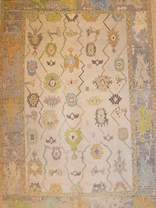 A rug with a colorful pattern on it is sitting on a table.