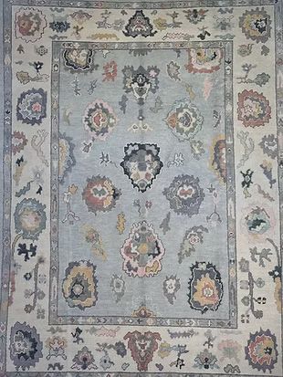 A rug with a floral pattern on it is sitting on a table.