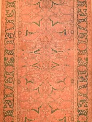 A close up of a rug with a pattern on it