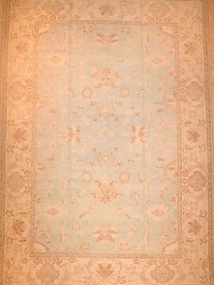 A rug with a floral pattern on it is sitting on a table.