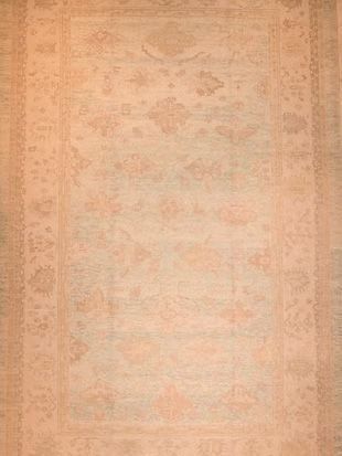 A close up of a rug with a floral pattern on it.