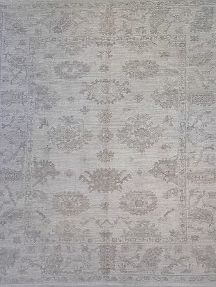 A close up of a rug with a floral pattern on it.