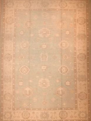 A rug with a floral pattern on it is sitting on a table.