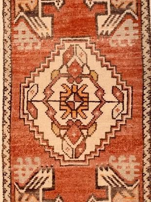 A close up of a rug with a geometric pattern on it