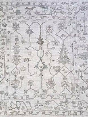 A close up of a rug with a pattern on it.