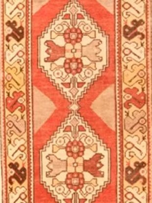 A close up of a rug with a floral pattern