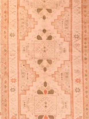 A close up of a rug with a pattern on it.