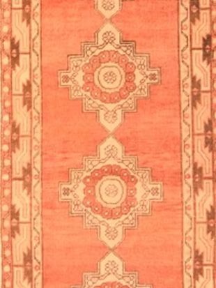 A close up of a rug with a pattern on it