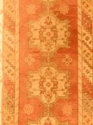 A close up of a rug with a pattern on it