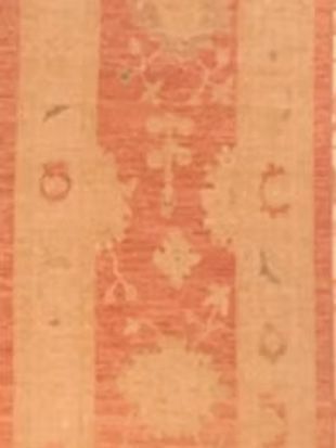 A close up of a rug with a floral pattern on it.