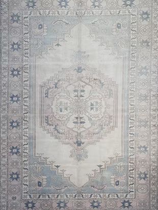 A close up of a rug with a pattern on it.