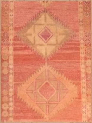 A pink rug with a geometric pattern on it