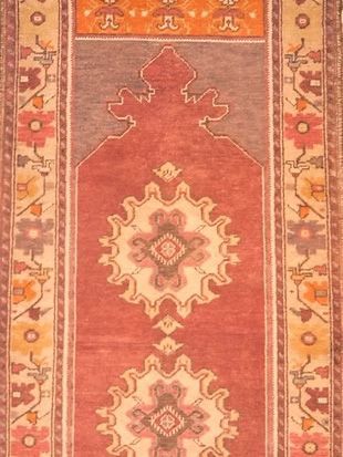 A close up of a rug with a pattern on it