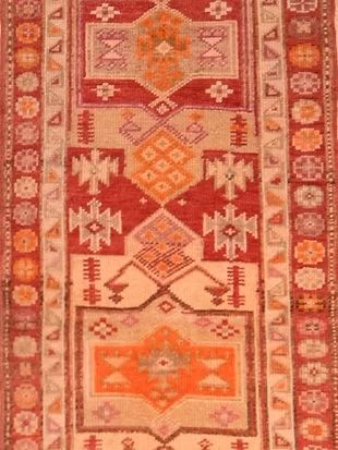 A close up of a rug with a geometric pattern on it