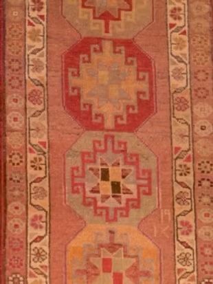 A close up of a rug with a pattern on it