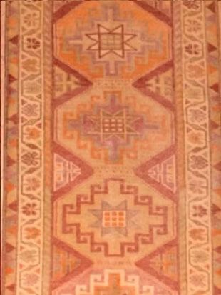 A close up of a rug with a geometric pattern