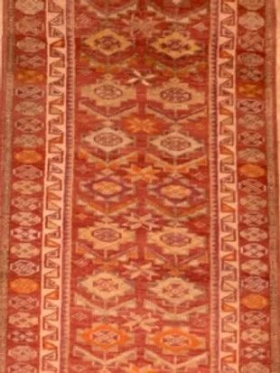 A close up of a rug with a pattern on it