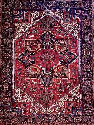 A close up of a rug with a pattern on it.