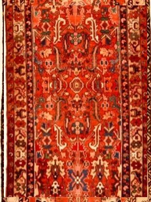 A red rug with a pattern on it is on a white background.