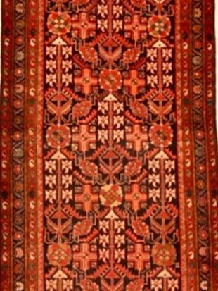 A close up of a rug with a pattern on it