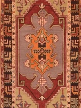 A close up of a rug with a geometric pattern