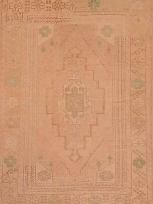 A close up of a rug with a pattern on it.