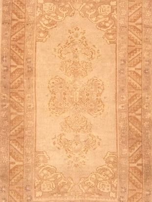 A close up of a rug with a floral pattern on it.