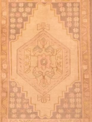 A close up of a rug with a pattern on it