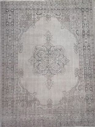 A close up of a rug with a pattern on it.