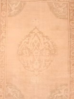 A close up of a rug with a pattern on it.