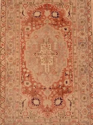 A close up of a rug with a pattern on it