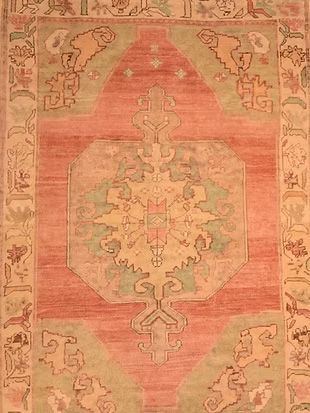 A close up of a rug with a floral pattern on it.