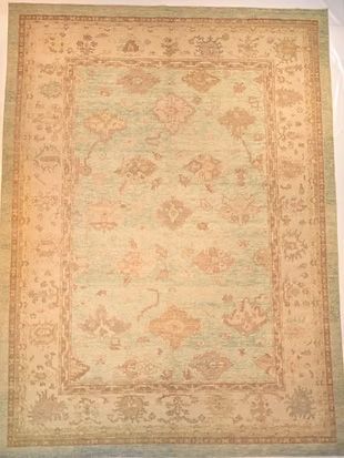 A rug with a floral pattern on it is sitting on a table.