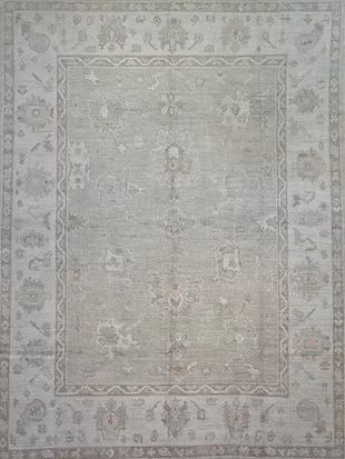 A close up of a rug with a square pattern on it.