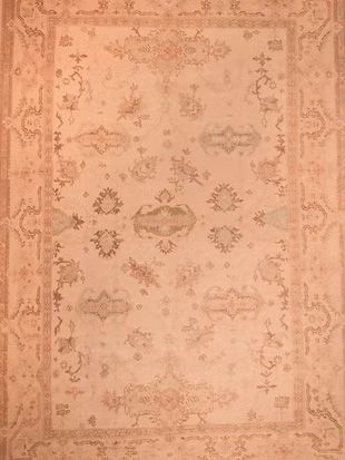 A close up of a rug with a floral pattern on it.